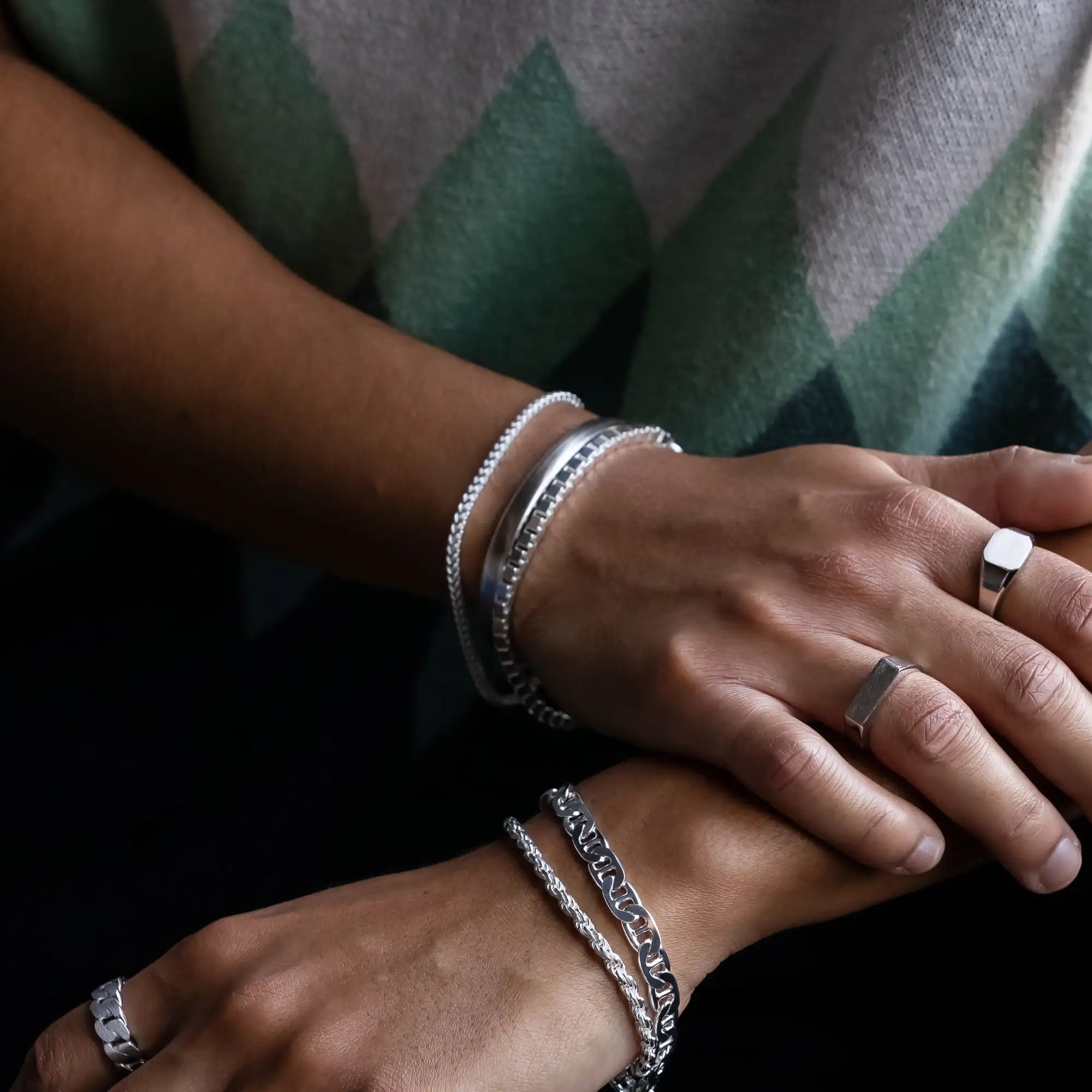 925 silver cuff bangle stacked with 925 sterling silver rope chain and 925 silver box chain bracelet on hands