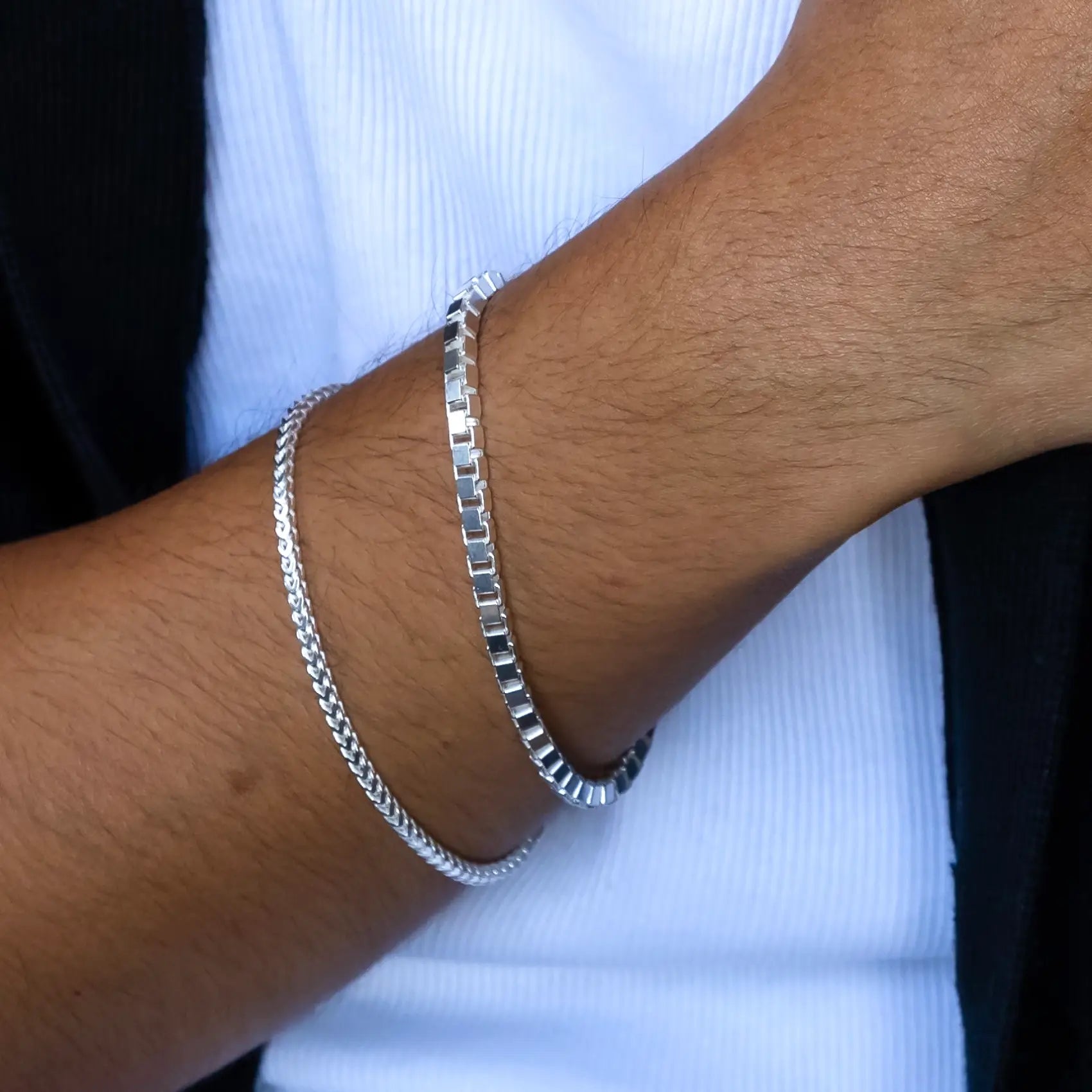 925 silver box bracelet stacked with 925 sterling silver franco bracelet on arm